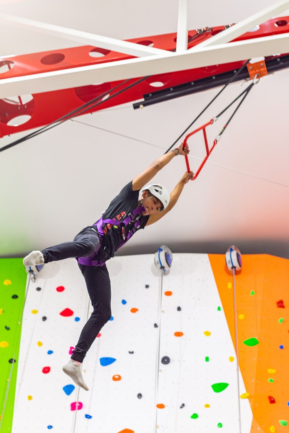 kid swings on Clip n Climb equipment Suniland Venezuela