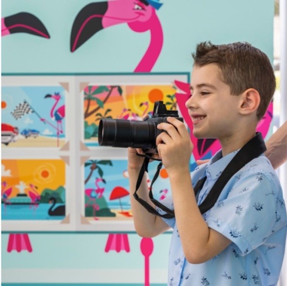 kid with camera the The Wheel ICON Park
