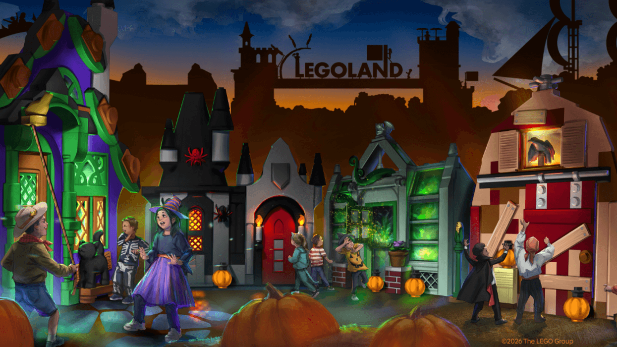 Kids in Halloween costumes explore LEGO-themed haunted houses at Legoland