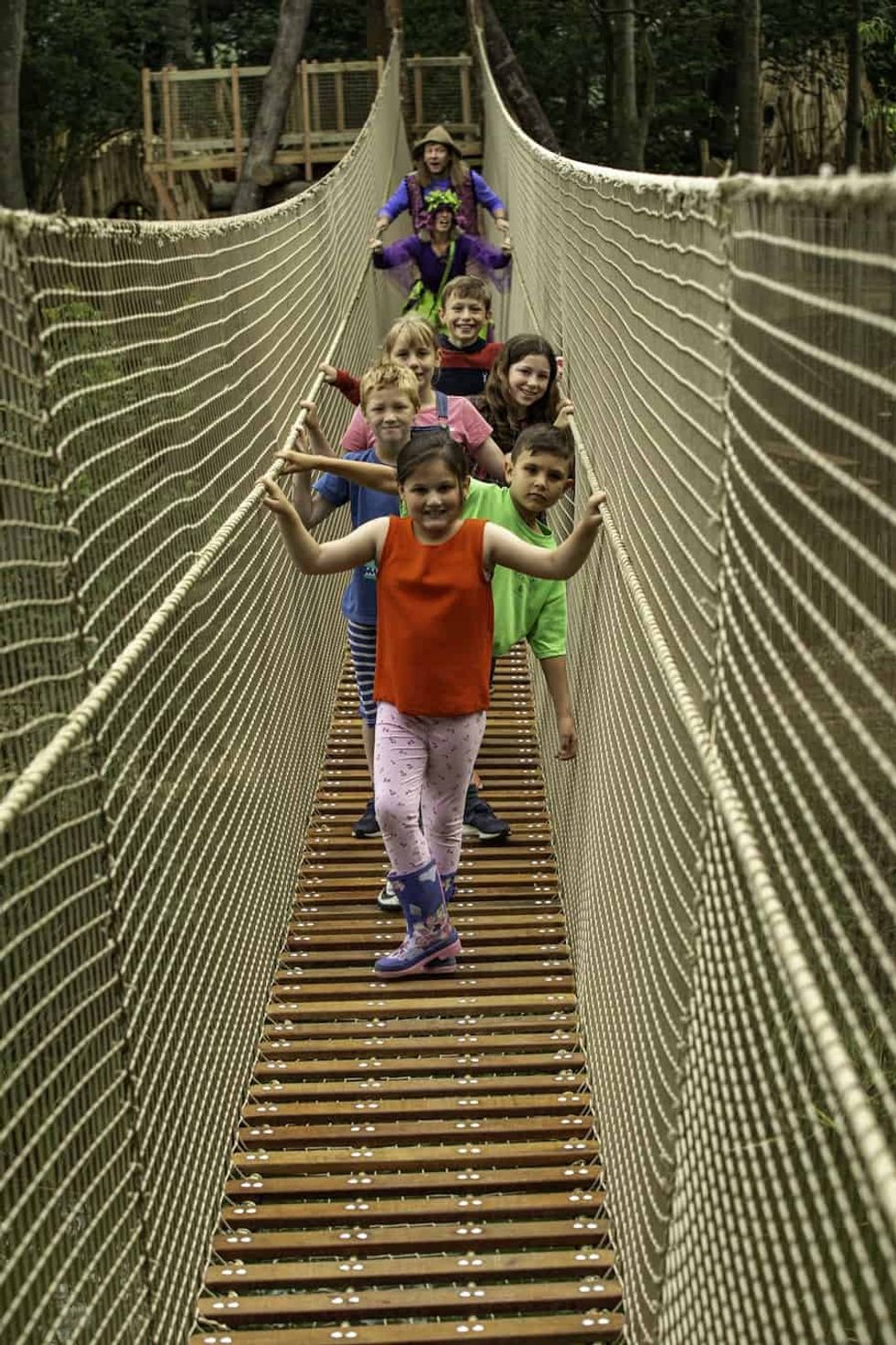 Kids on a rope bridge at Castle Haward's Skelf Island playground