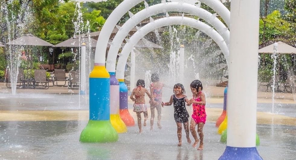 Kids play on splashpad