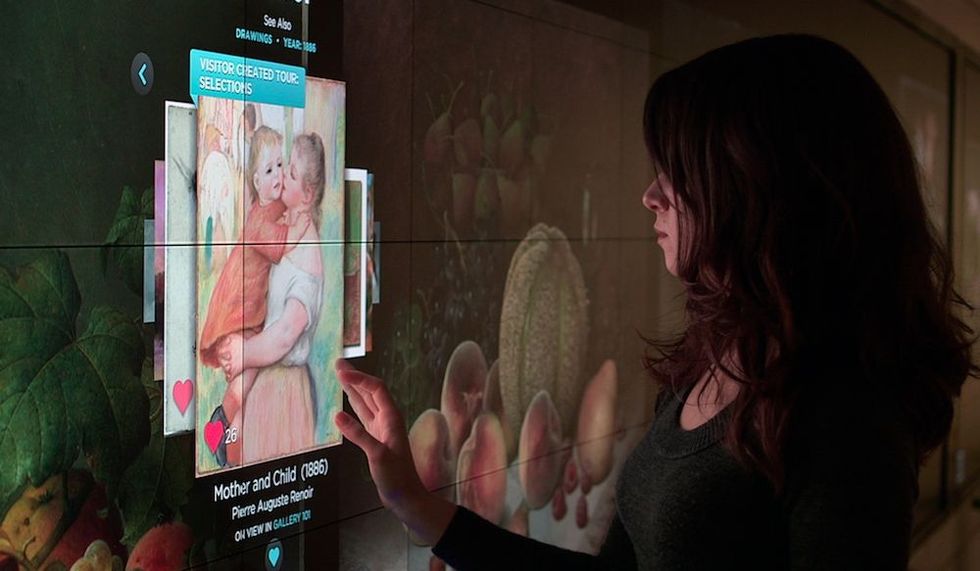 lady linteracts with Collection Walll cleveland museum of art Blooloop