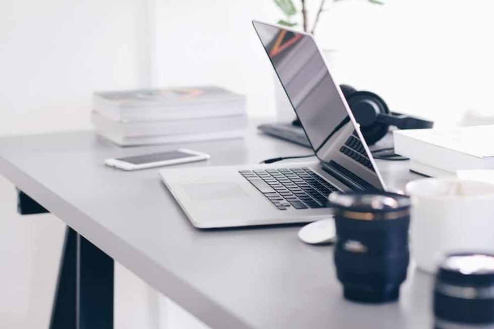 laptop phone and tea on desk working from home