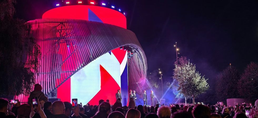 large crowd watching Media Matrexx \u2014 High-Tech Landmark of the Urban Core at night