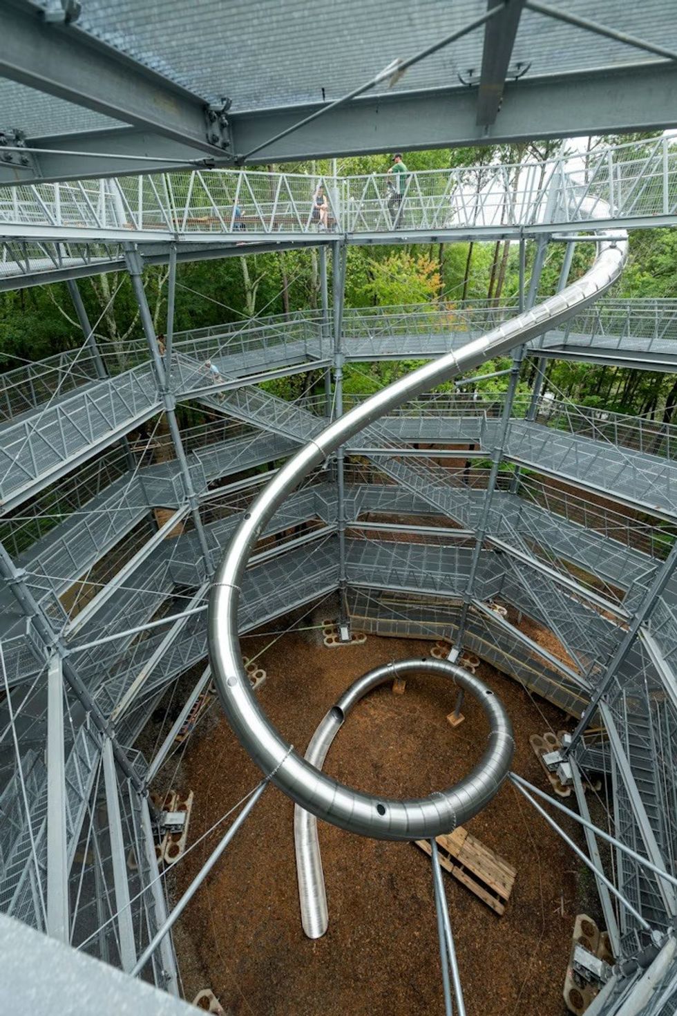 Large metallic slide going from the top of The Nautilus Observation Tower to the ground