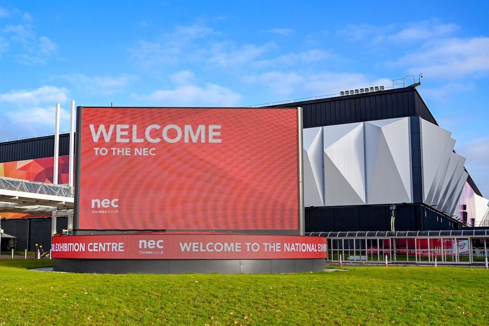 Large sign reading "Welcome to the NEC" outside the National Exhibition Centre.