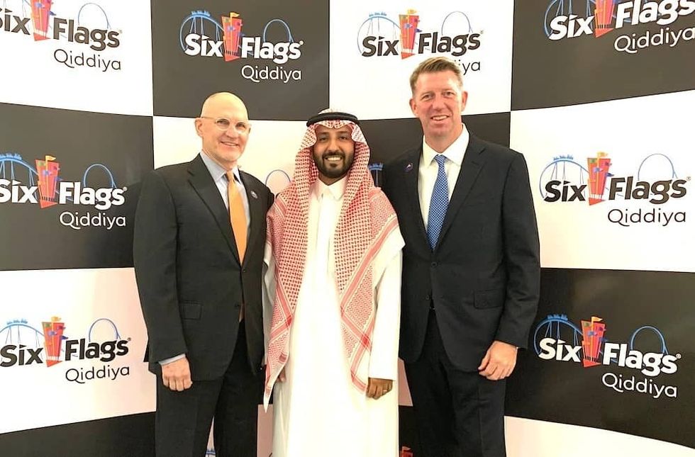 Left to right: Qiddiya CEO and chief of staff Mike Reininger and Faisal Al Moither with David McKillips, president of international development for Six Flags