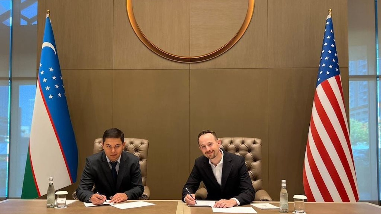 Legacy's Eric Carnagey (at right) Signs New Water Park Deal in Tashkent Uzbekistan July 18 2023