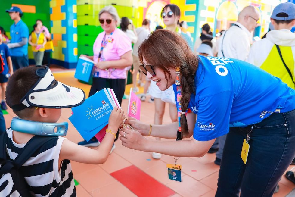 LEGOLAND Staff handing out Grand Opening flags