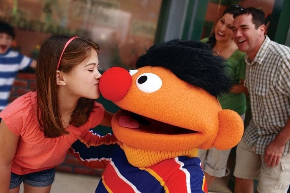 Little girl kissing Ernie on his nose at SeaWorld Orlando