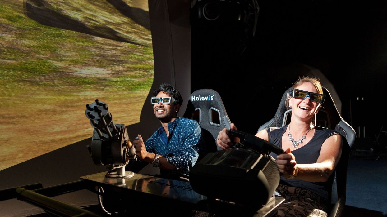 man and woman try next gen vr dark rideholovis