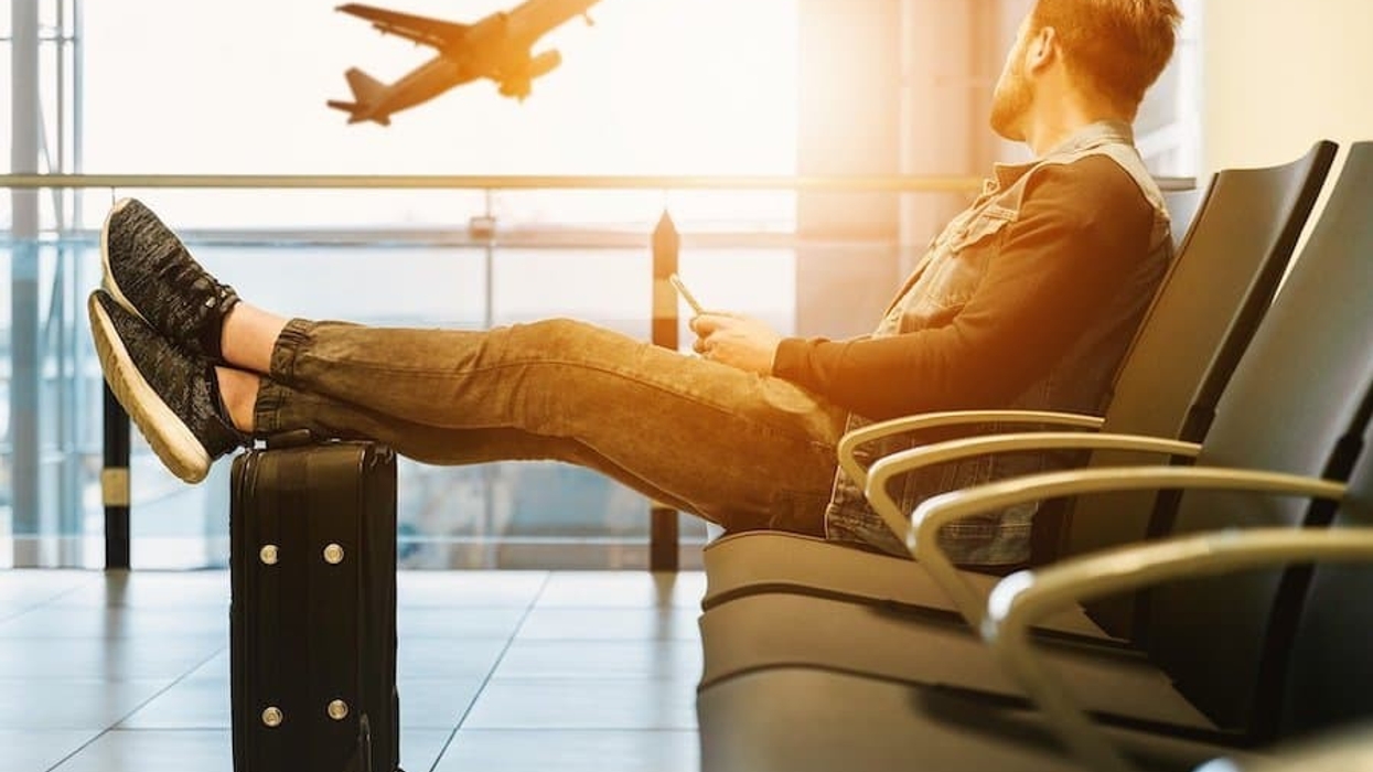 Man at airport sunset