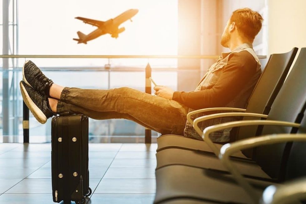 Man at airport sunset