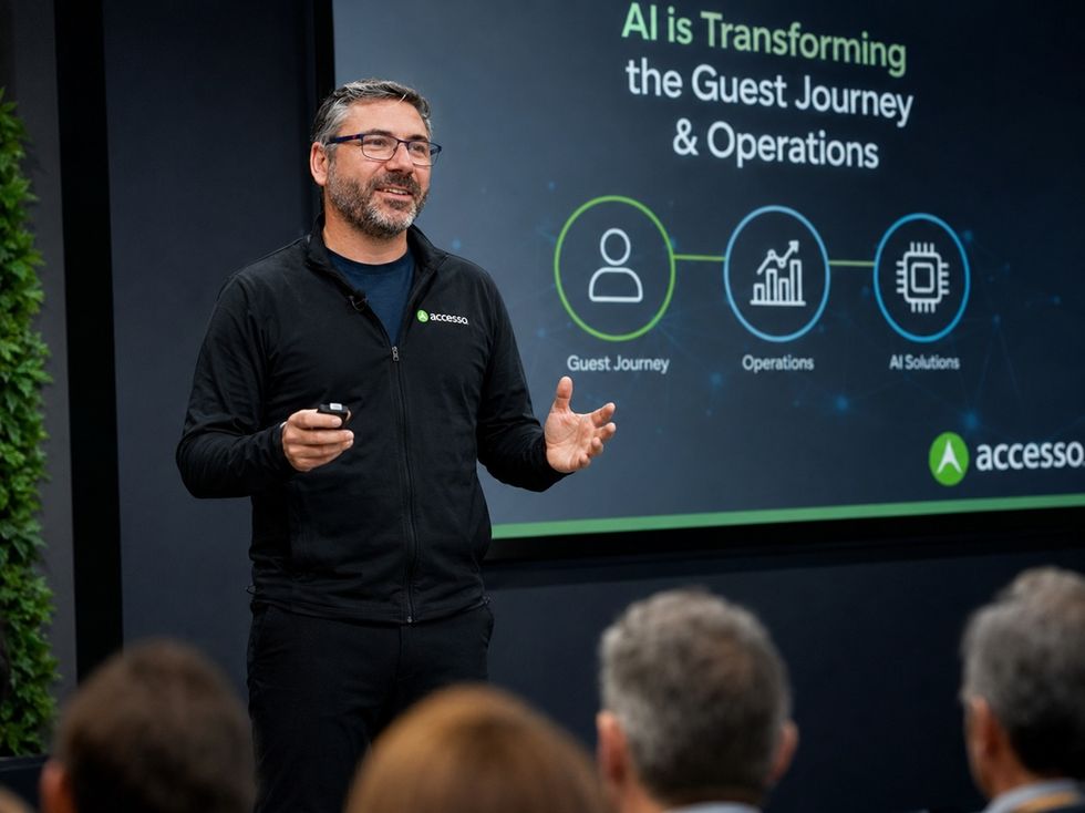 Man named Lee Cowie presenting on AI in guest journey and operations at a conference.