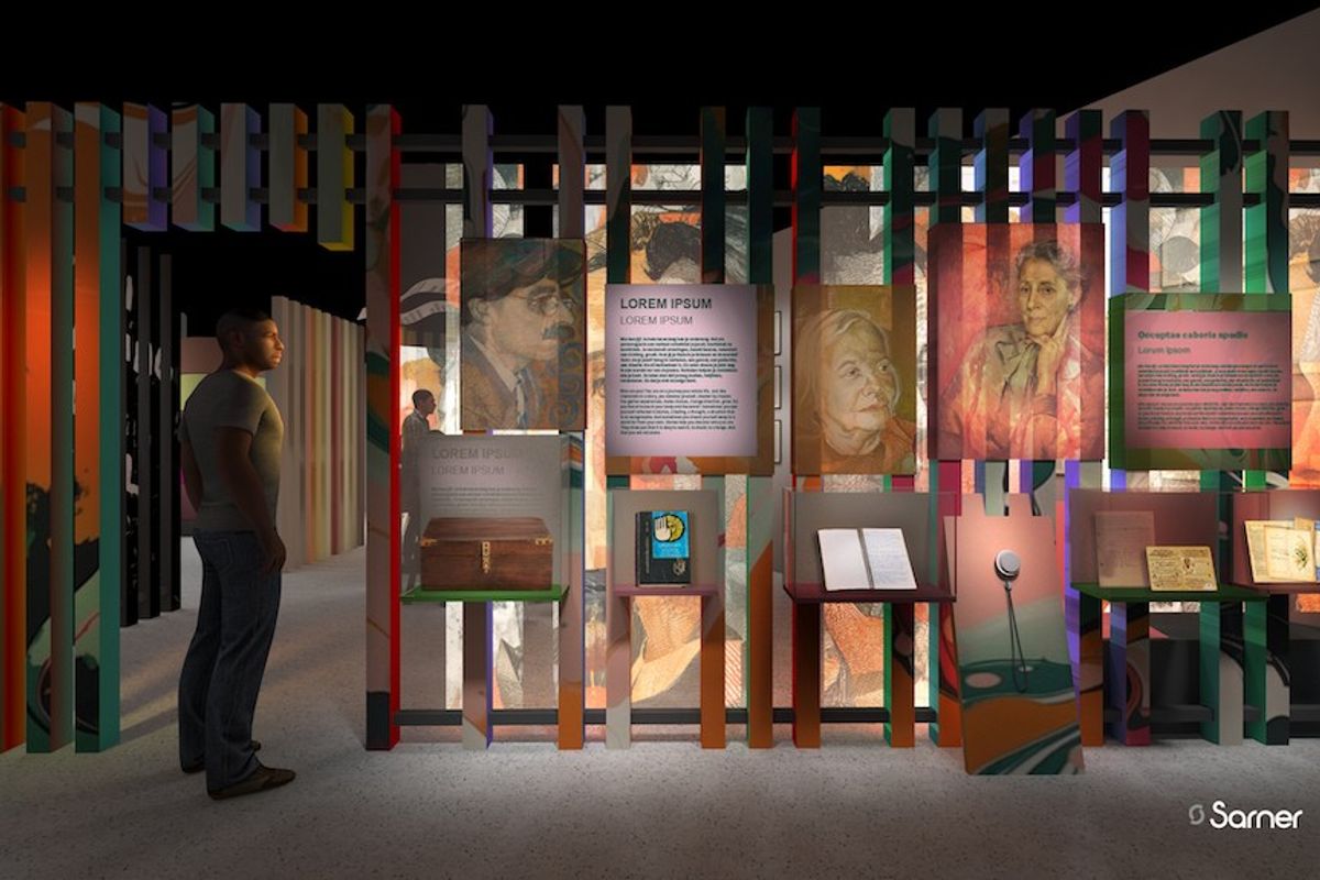 Man observing an illuminated museum exhibit with colorful panels and portraits.