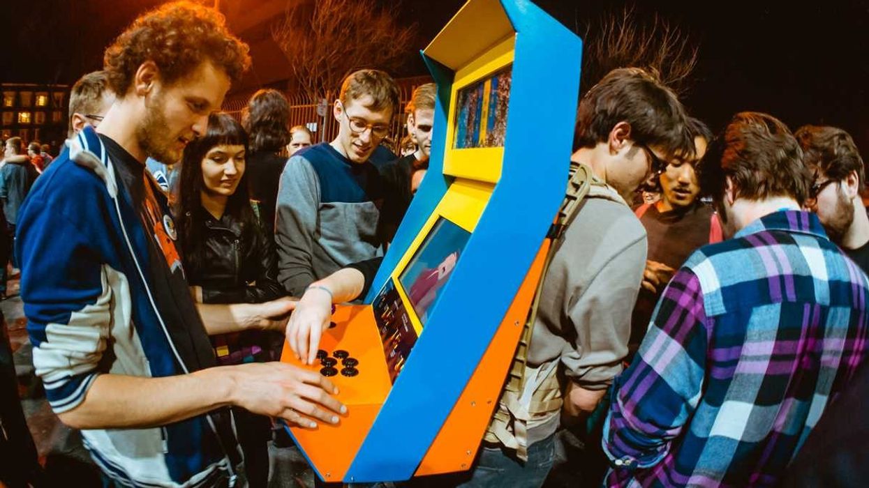 Man plays videogame at Videogames exhibition at the V&A