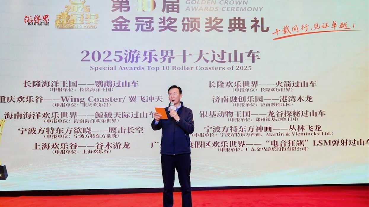 Man speaking at the 2025 Top 10 Roller Coasters award ceremony.