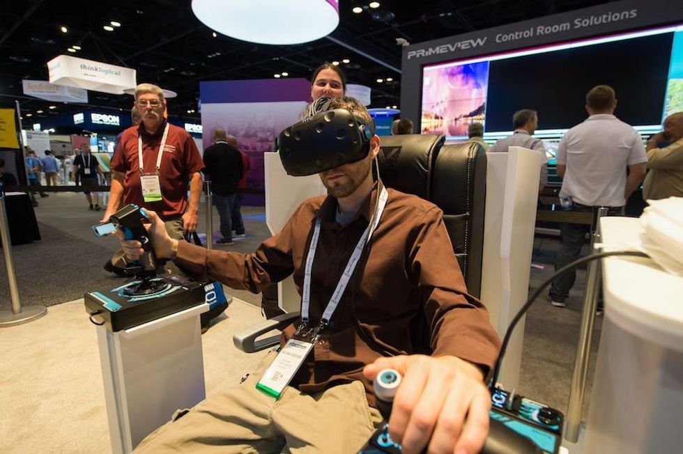man tries vr goggles at infocomm