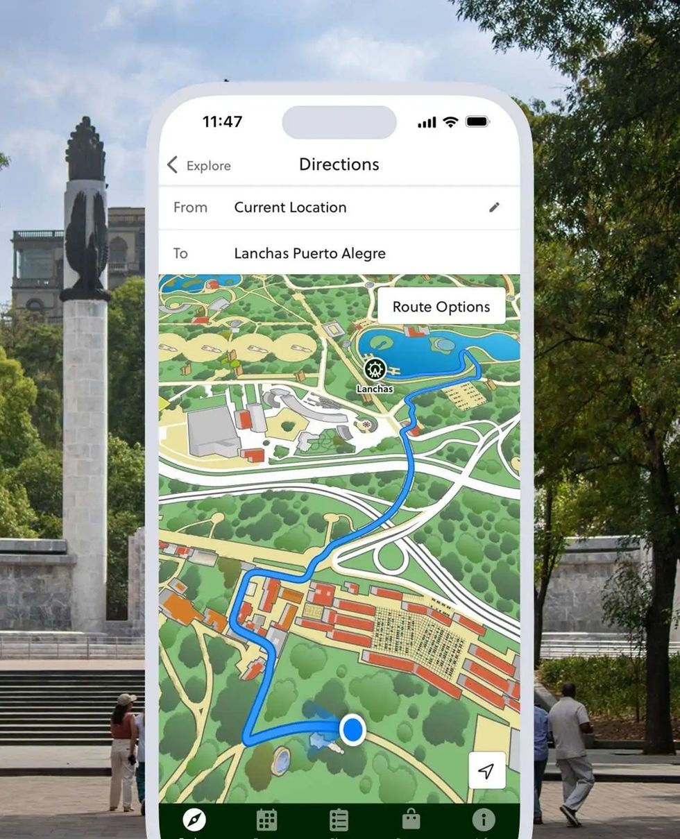 Map app showing route to "Lanchas Puerto Alegre" overlaid on a park monument background.