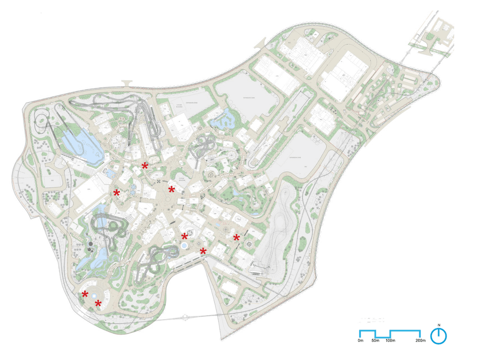Map of an urban park with paths, buildings, and marked points of interest.