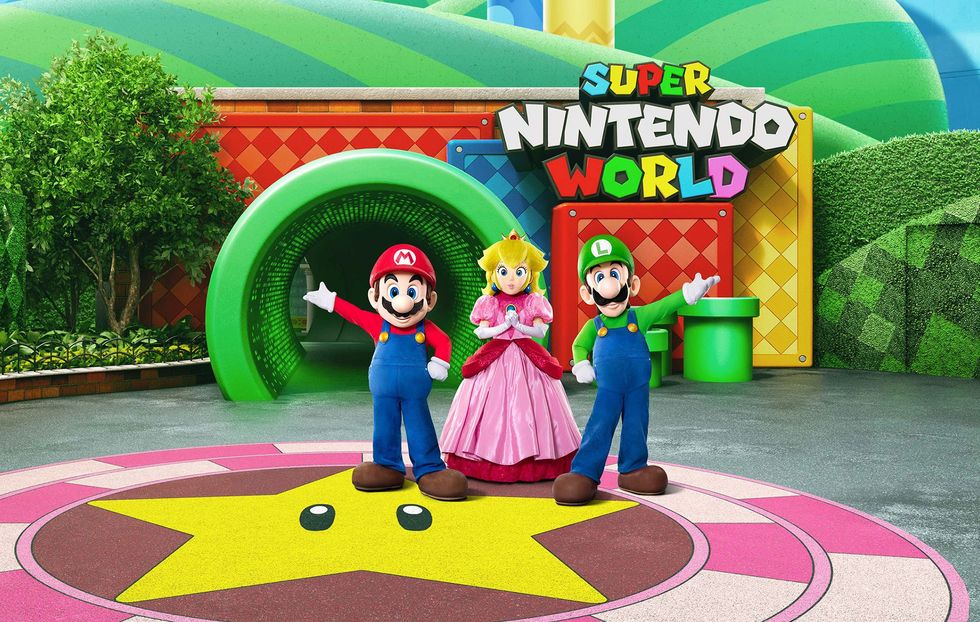 Mario, Luigi, and Princess Peach at Super Nintendo World entrance