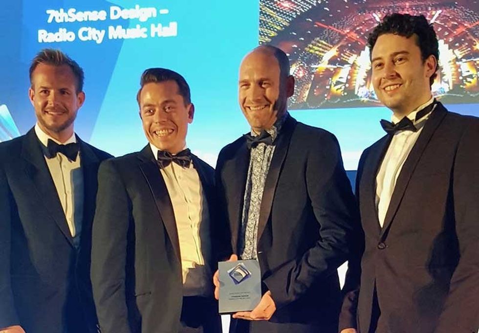 Matt Barton Ed Patchett and Elliot Byrne from 7thSense Design collect the award