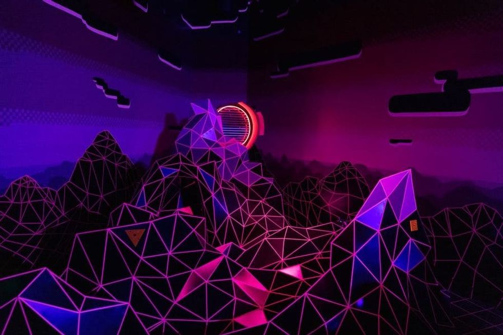 Meow Wolf dark ride Kaleidoscape mountain landscape