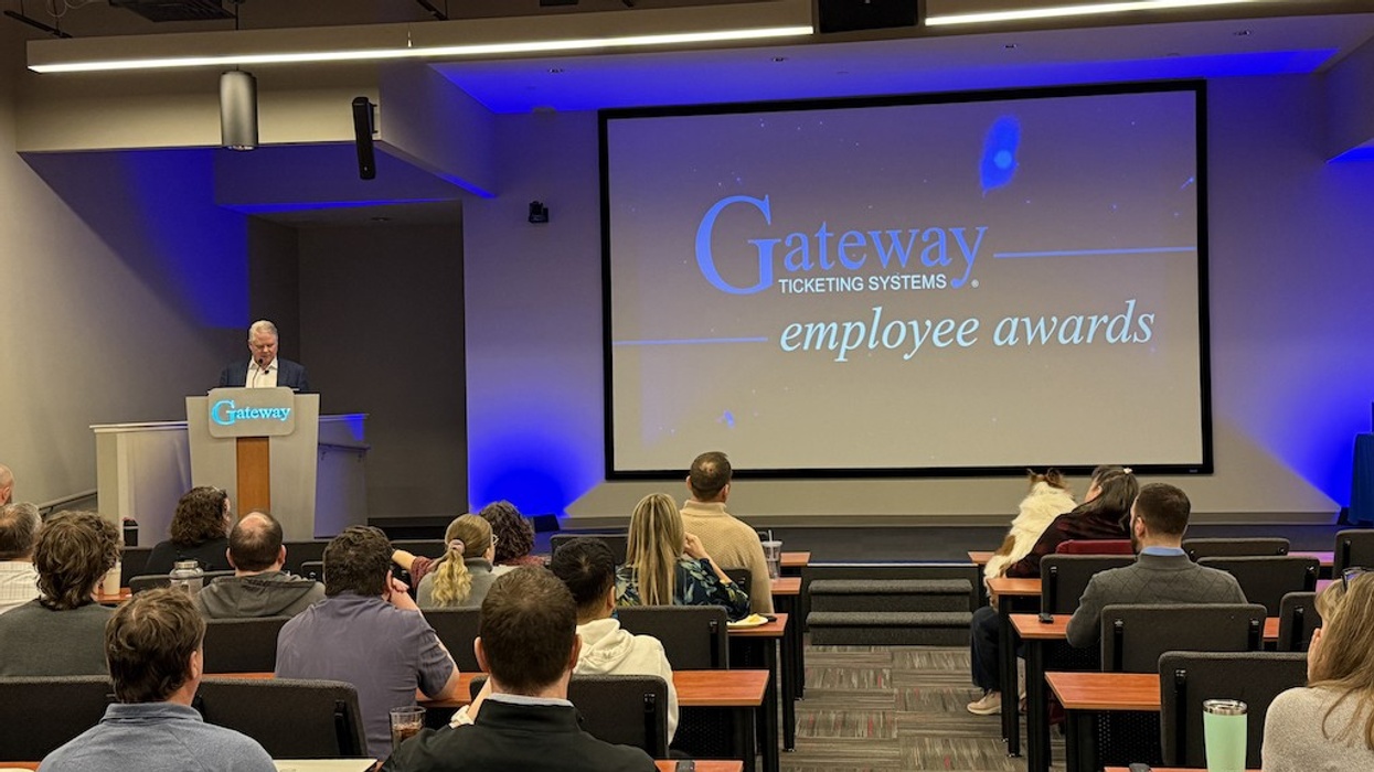 Michael Andre speaks at Gateway employee awards event in a conference room.