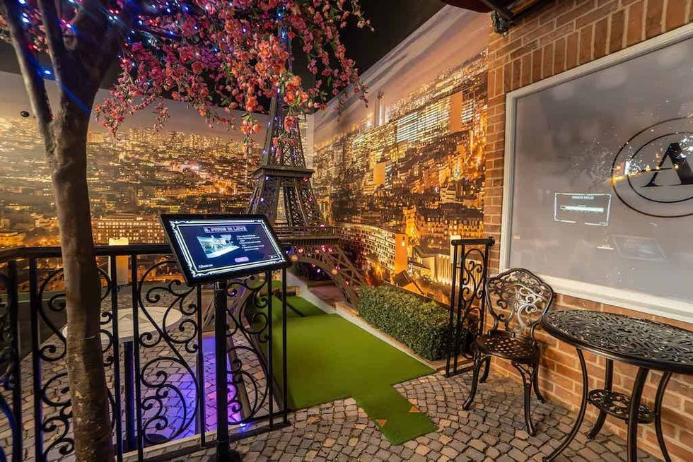 Mini Eiffel Tower and Paris mural at Albatross mini golf