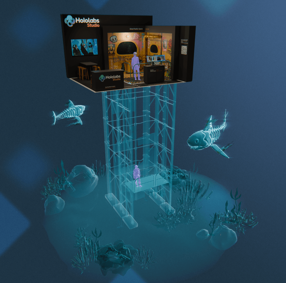 Mixed reality exhibit with digital sharks under a Hololabs Studio display.