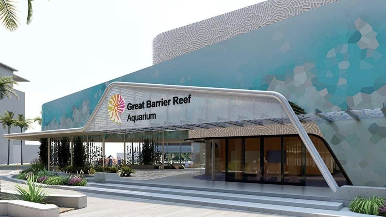 Modern building entrance of "Great Barrier Reef Aquarium" with a colorful exterior design.