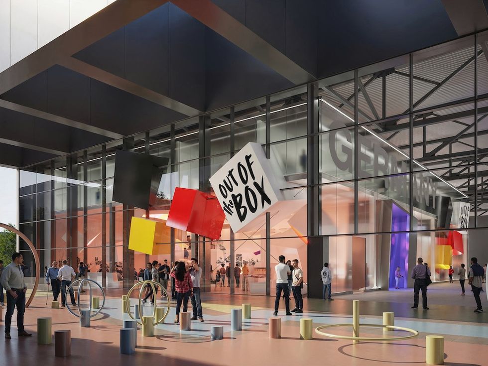 Modern building facade with colorful art, people mingling, and "Out of the Box" signage.