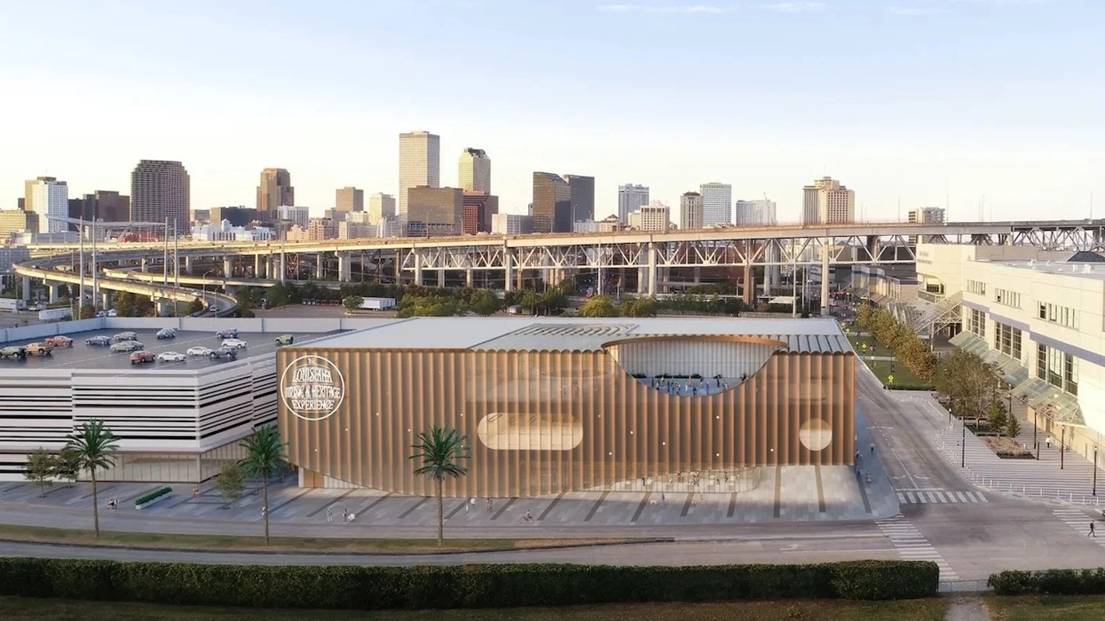 Modern building for Louisiana Music & Heritage Experience, with unique design, city skyline, and highway in the background.