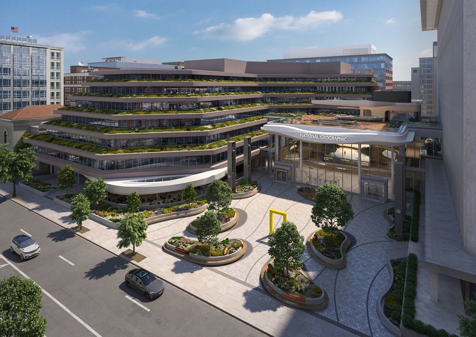 Modern building with green terraces, labeled "National Geographic," and landscaped plaza.