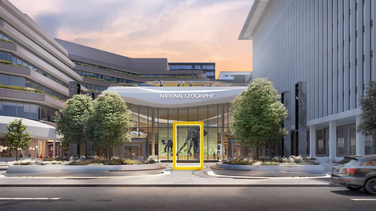 Modern building with "National Geographic" signage and a large yellow frame entrance.