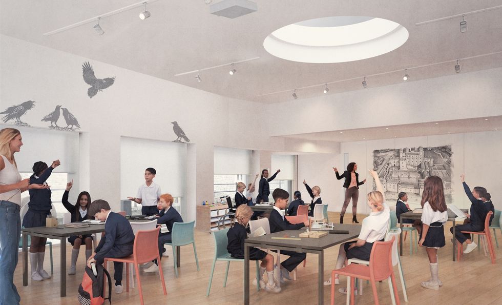 Modern classroom at the Tower of London with students and teachers under circular skylight.