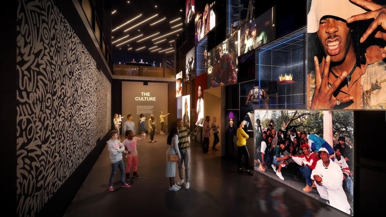 Modern exhibit with people and illuminated hip-hop photos, labeled "The Culture."