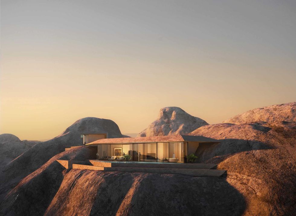 Modern hotel nestled on rocky terrain at sunset at The Red Sea