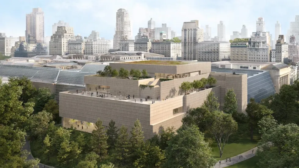 Modern museum building surrounded by city skyscrapers and lush trees.