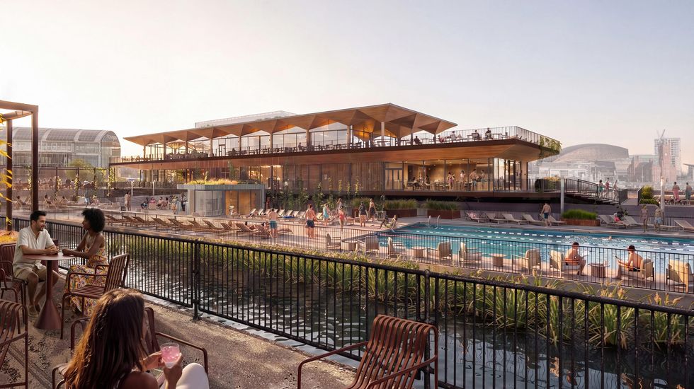 Modern riverside building with a swimming pool and terrace, people relaxing and dining.