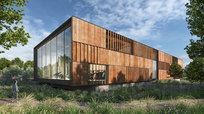 Modern, rust-colored building called the Bruce Springsteen Center for American Music with large windows, surrounded by greenery and under a blue sky.