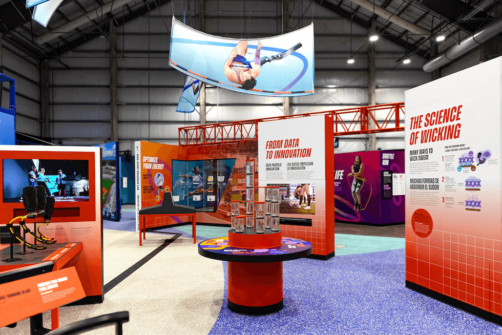 Modern sports exhibition with displays on innovation and wicking science in a spacious hall.