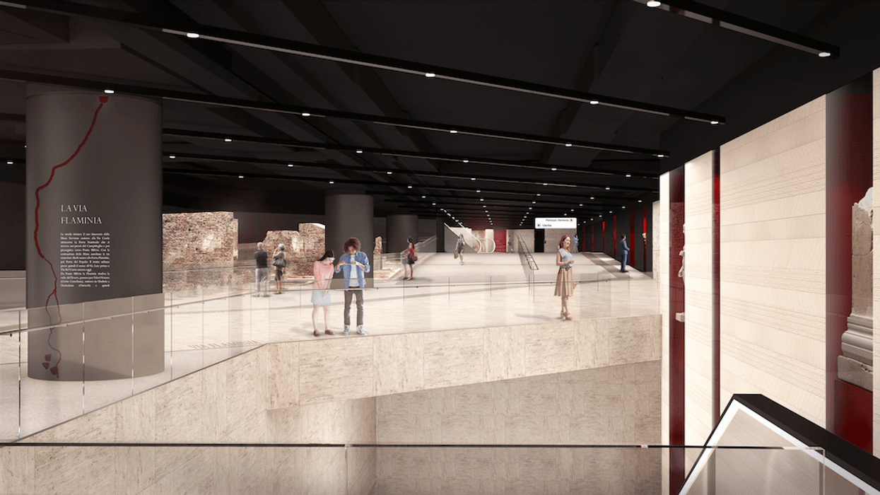 Modern underground museum with ancient ruins and visitors milling about.