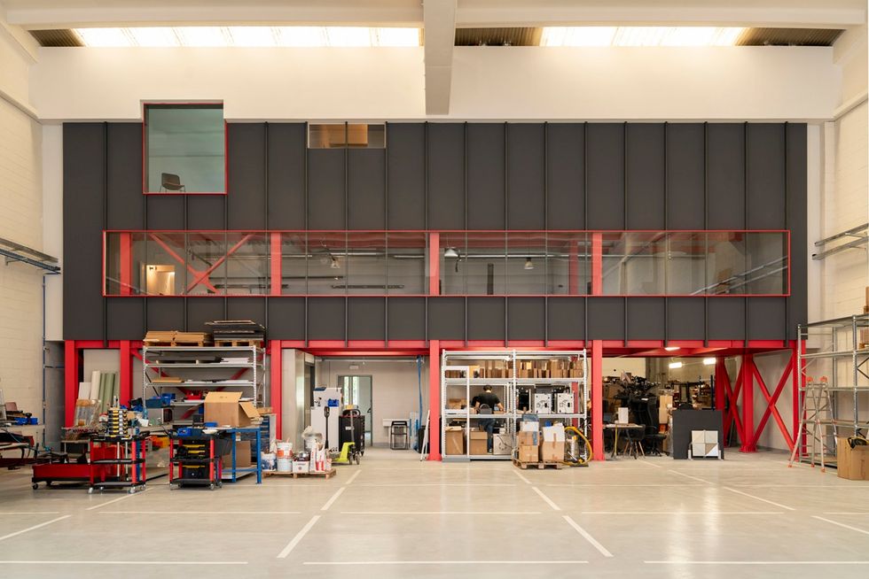 Modern warehouse interior at Leva Grid, with industrial shelving and equipment.