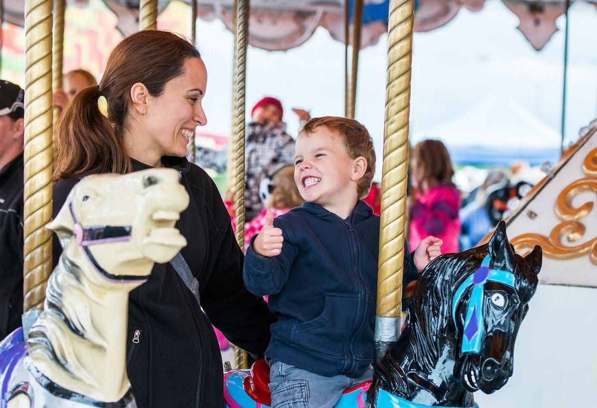 mother and child on carousel theme park investment adbobe copy 1 (1)