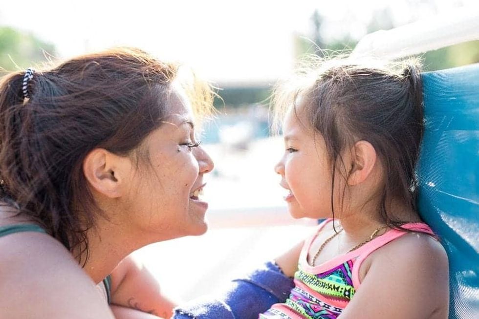 Mother talking to her daughter at Give Kids The World