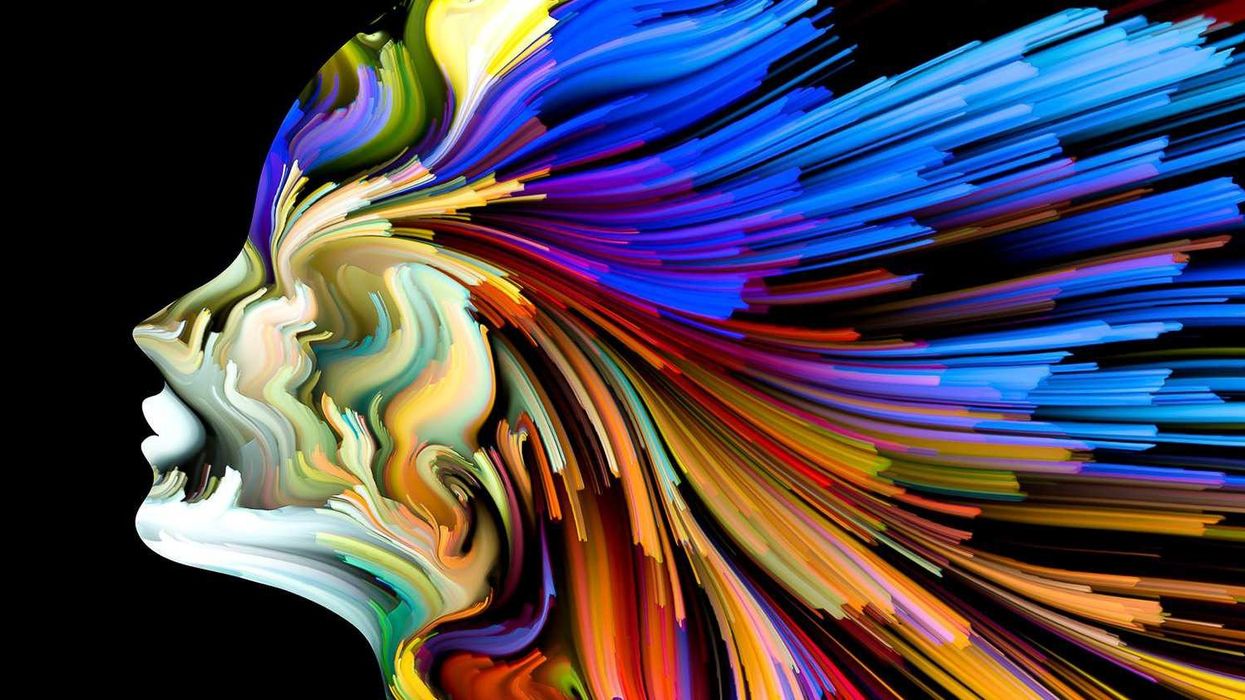 multi-coloured graphic image of woman's head LED radiance digital projection 8K laser projector