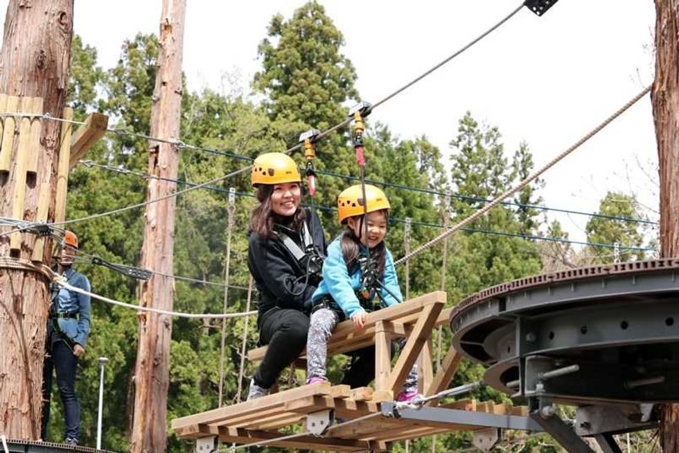 mum and child attempt ropes course lotte arai resort
