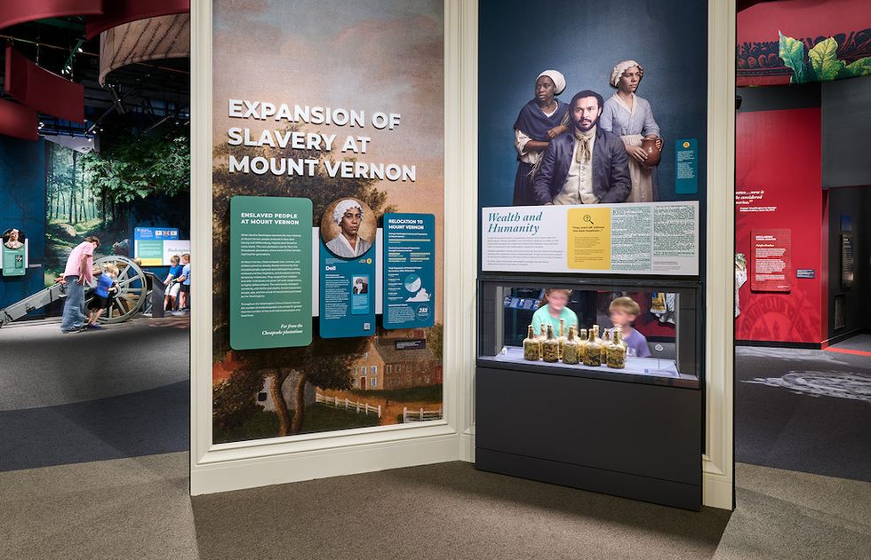 Museum exhibit on slavery at Mount Vernon with informative panels and artifacts.