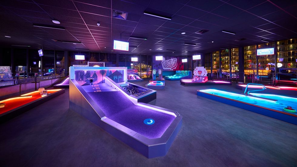 Neon-lit indoor mini golf course from 360Golf with various colourful holes and obstacles.